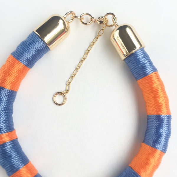Light blue and orange hand-woven silk satin bracelet with a tassel | KRISTINAGOESWEST.COM - 4